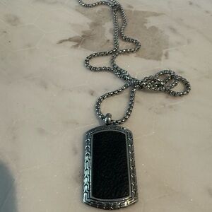 Saks Fifth Avenue stainless steel and Black Pendant Necklace. Leather in the mid